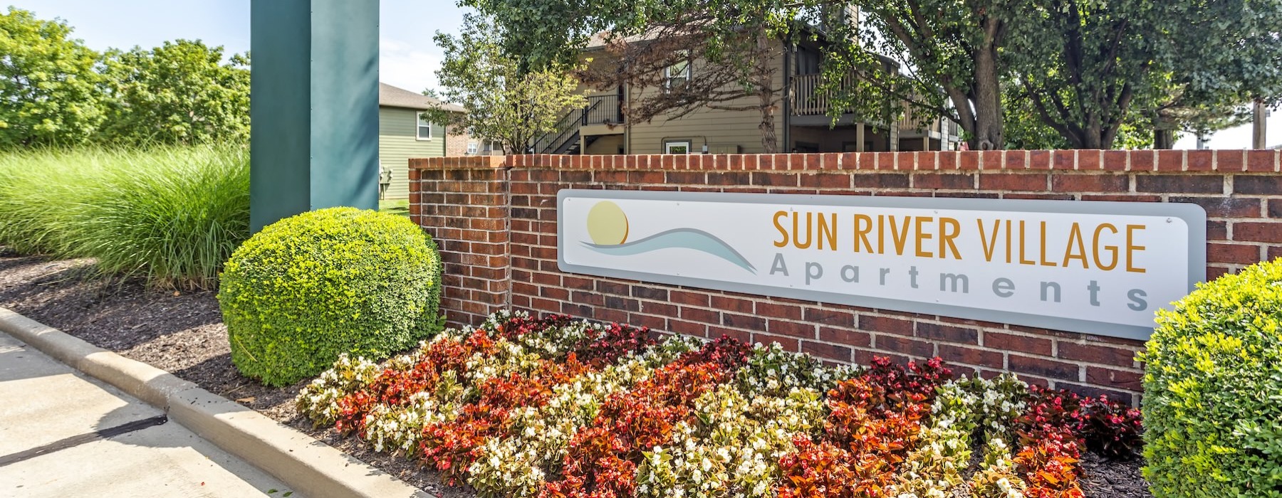 a garden with a sign