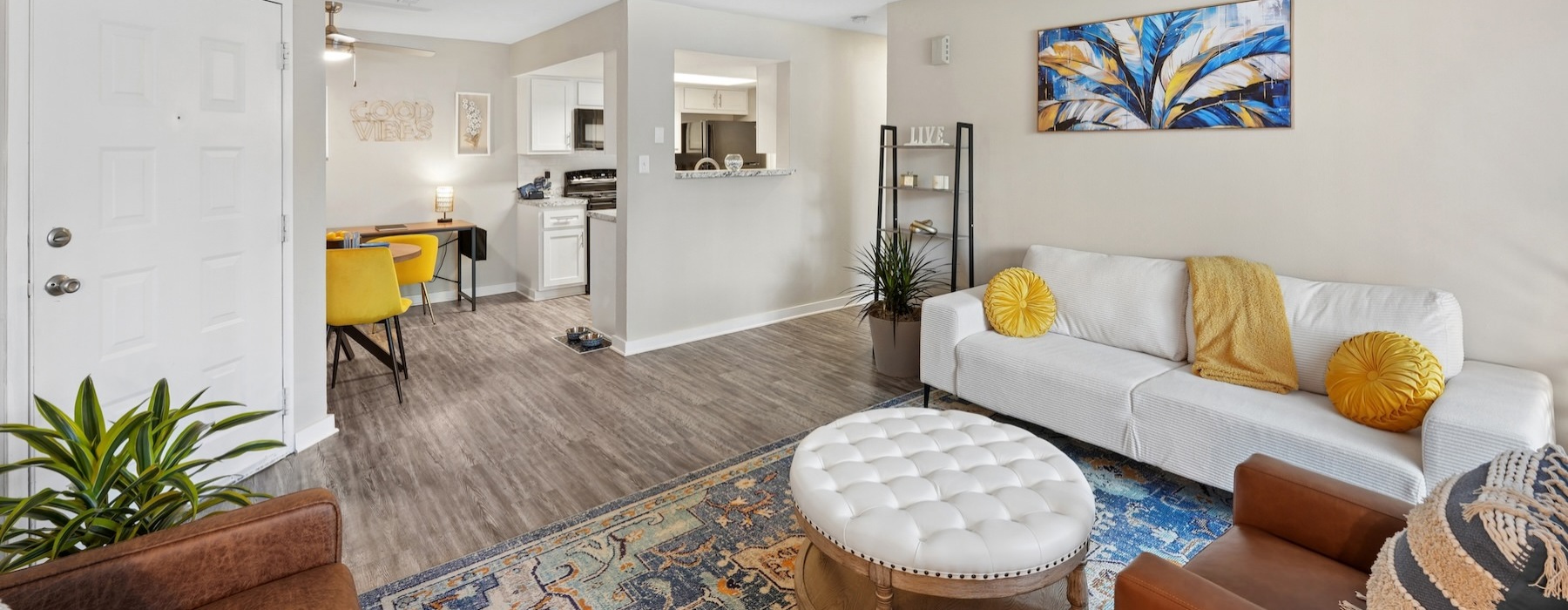 a living room with a couch and chairs